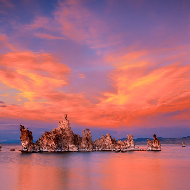 Sunset over Mono Lake with tufa towers and colorful sky.