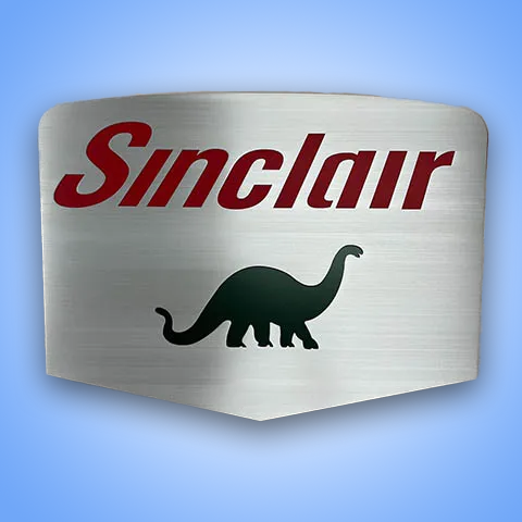 Custom metal Sinclair sign with dinosaur silhouette.