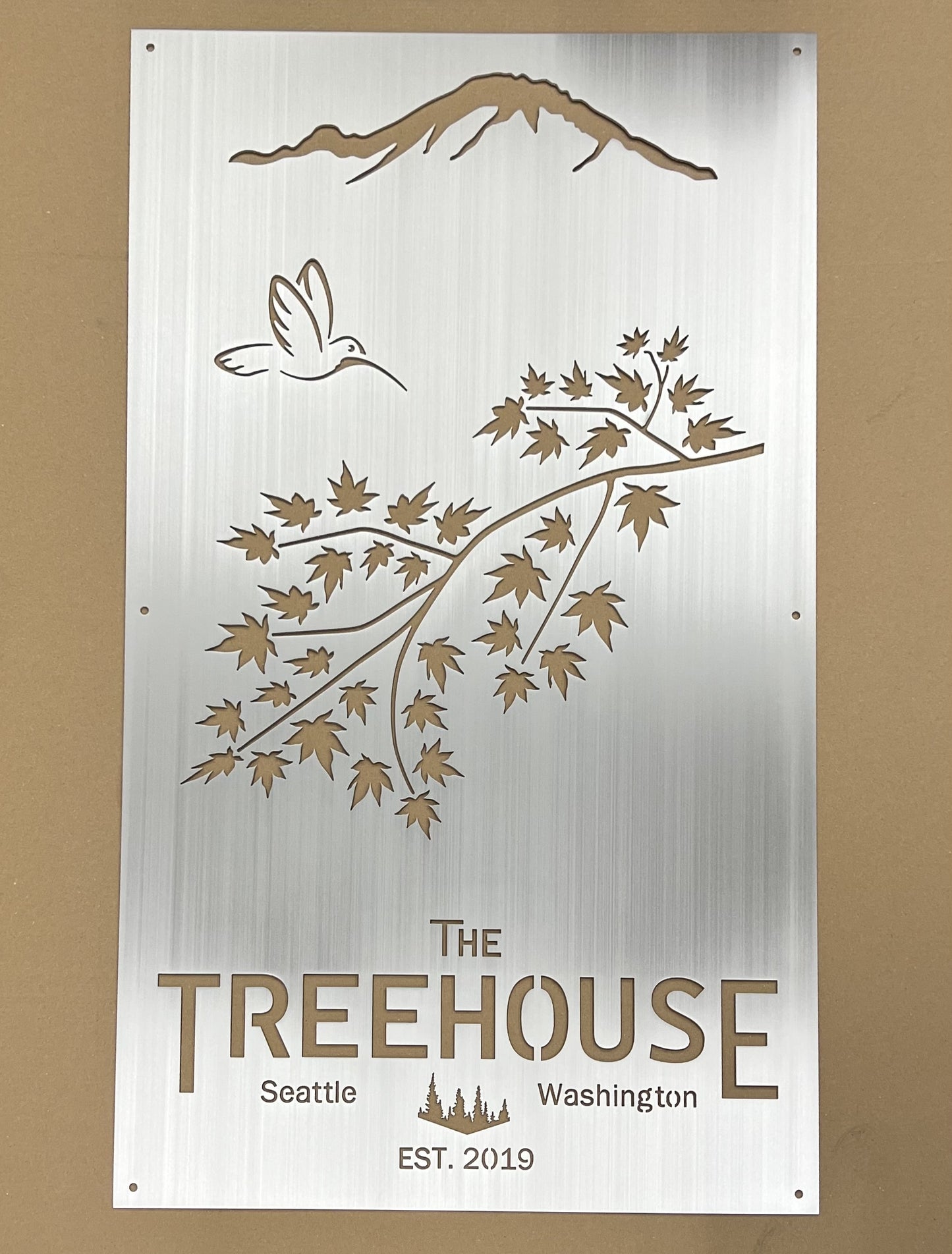 Custom treehouse sign for a resort