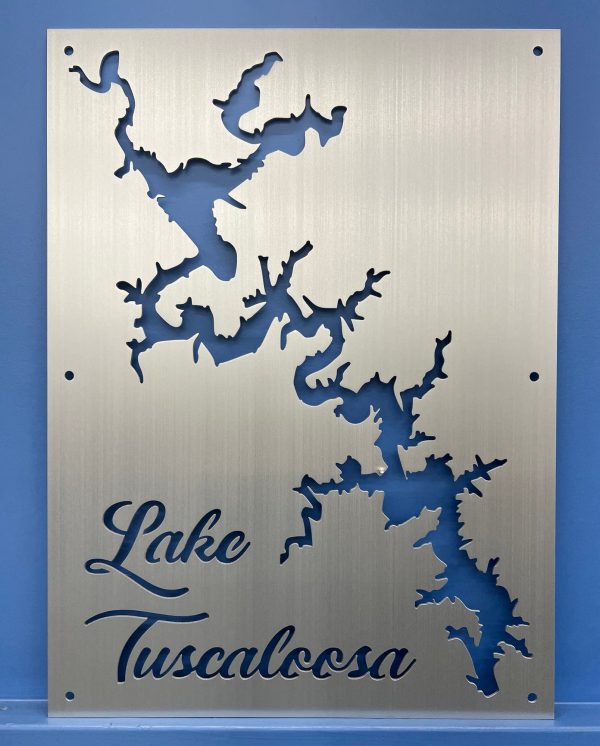 Lake Tuscaloosa custom metal cutout map with elegant script, mounted on a blue wall.