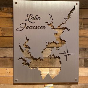 Lake Jocassee custom metal map with intricate cutout design and compass rose on wooden wall background.