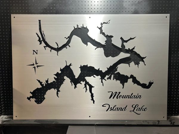 Mountain Island Lake metal map with compass rose on brushed silver, mounted on a black pegboard.