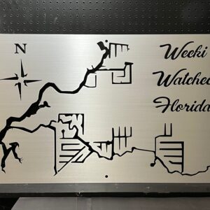 Weeki Wachee, Florida custom metal map with compass rose, featuring detailed cutouts, mounted on a black pegboard.