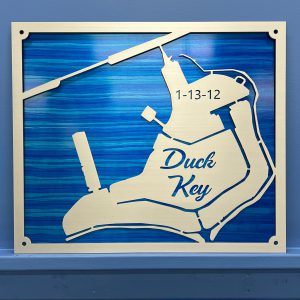 Duck Key Custom Lake Map with date 1-13-12 on a blue background, mounted on a wall.