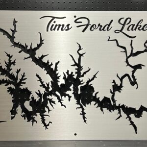 Tims Ford Lake metal map with intricate cutout design and compass rose on brushed silver, mounted on a pegboard.