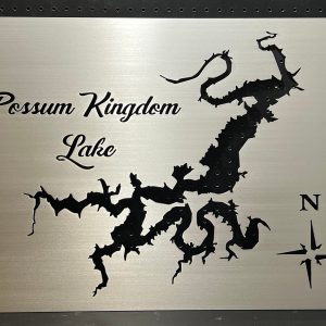 Possum Kingdom Lake metal map with compass rose, featuring intricate cutout design on brushed silver, mounted on a black pegboard.