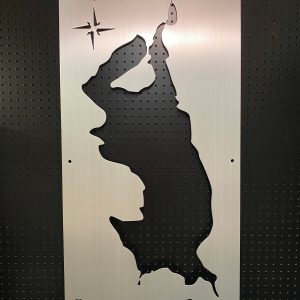 Spanaway Lake metal map with compass rose cutout, mounted on a black pegboard.