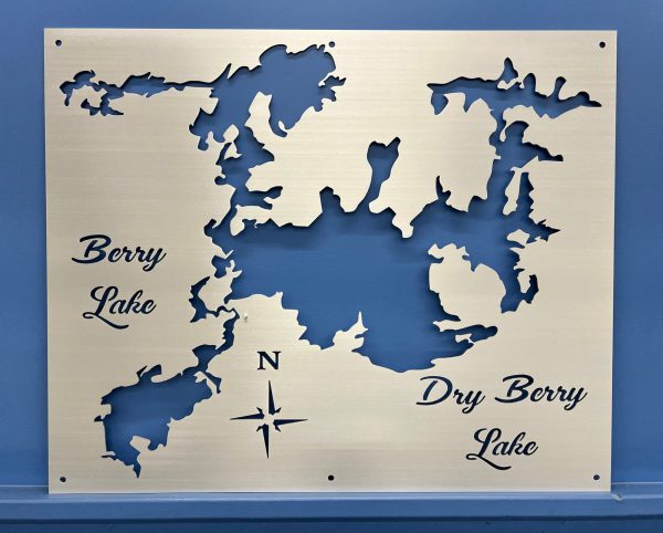 Berry Lake and Dry Berry Lake custom metal map with compass rose on brushed surface.