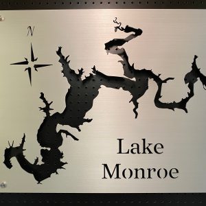 Lake Monroe metal cutout map with compass rose on a perforated black background.