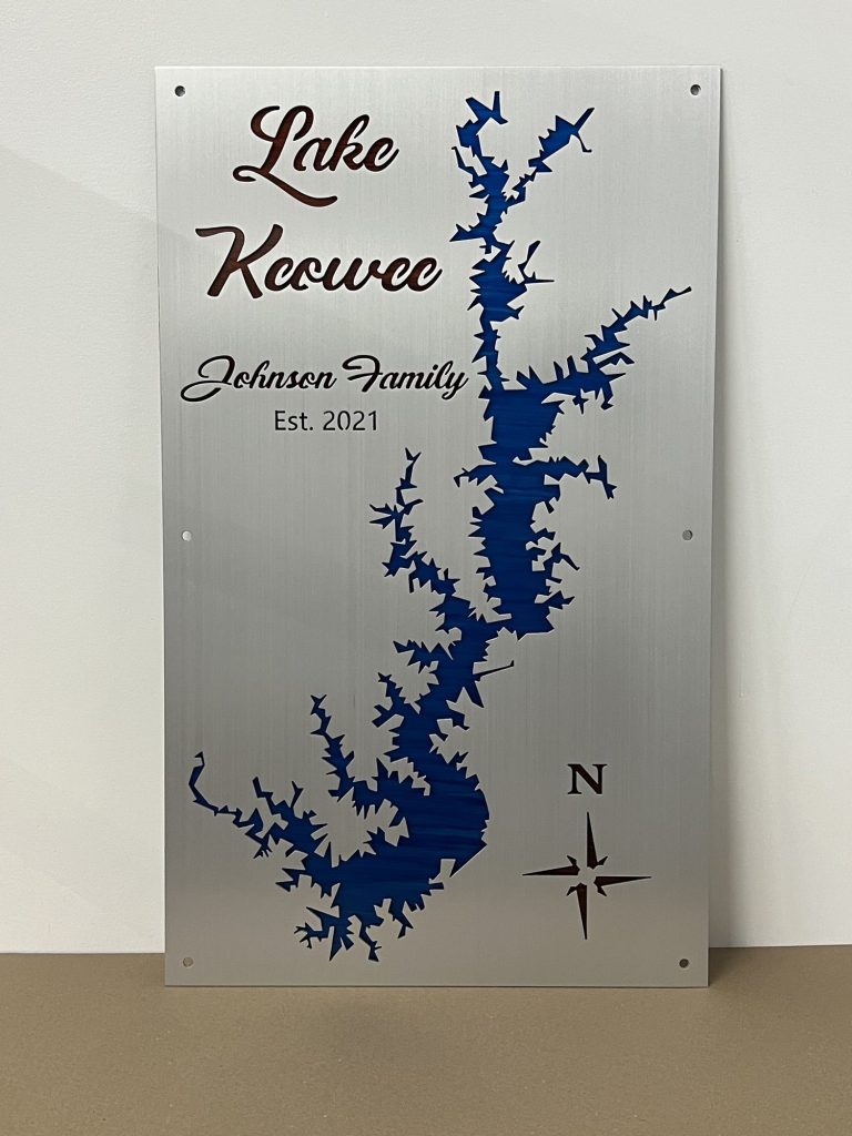 Lake Keowee metal map featuring "Johnson Family, Est. 2021" with a compass rose on a brushed metallic background.