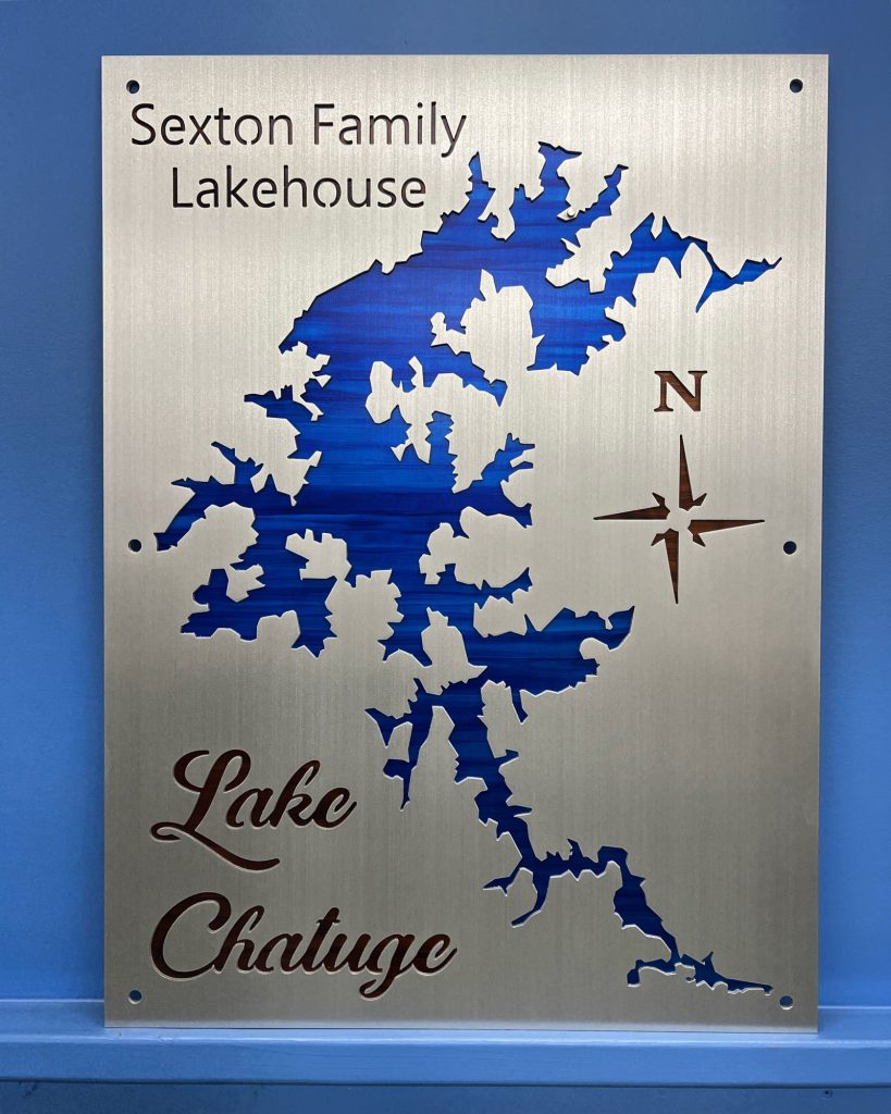 Sexton Family Lakehouse sign featuring a blue Lake Chatuge map with compass rose on brushed metal.