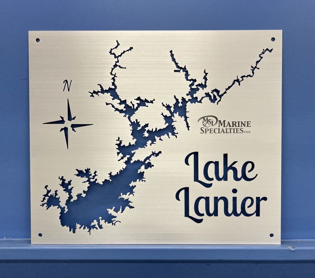 Lake Lanier metal map with compass rose and Marine Specialties logo on a blue wall.