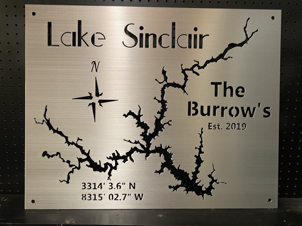 Lake Sinclair metal map with "The Burrow's" and compass rose, established 2019, coordinates included on brushed metal.