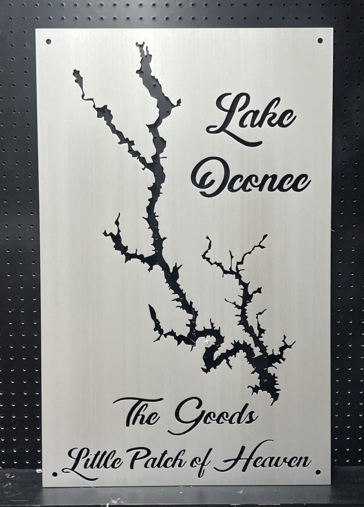 Lake Oconee metal map with "The Goods Little Patch of Heaven" text on a brushed silver background.