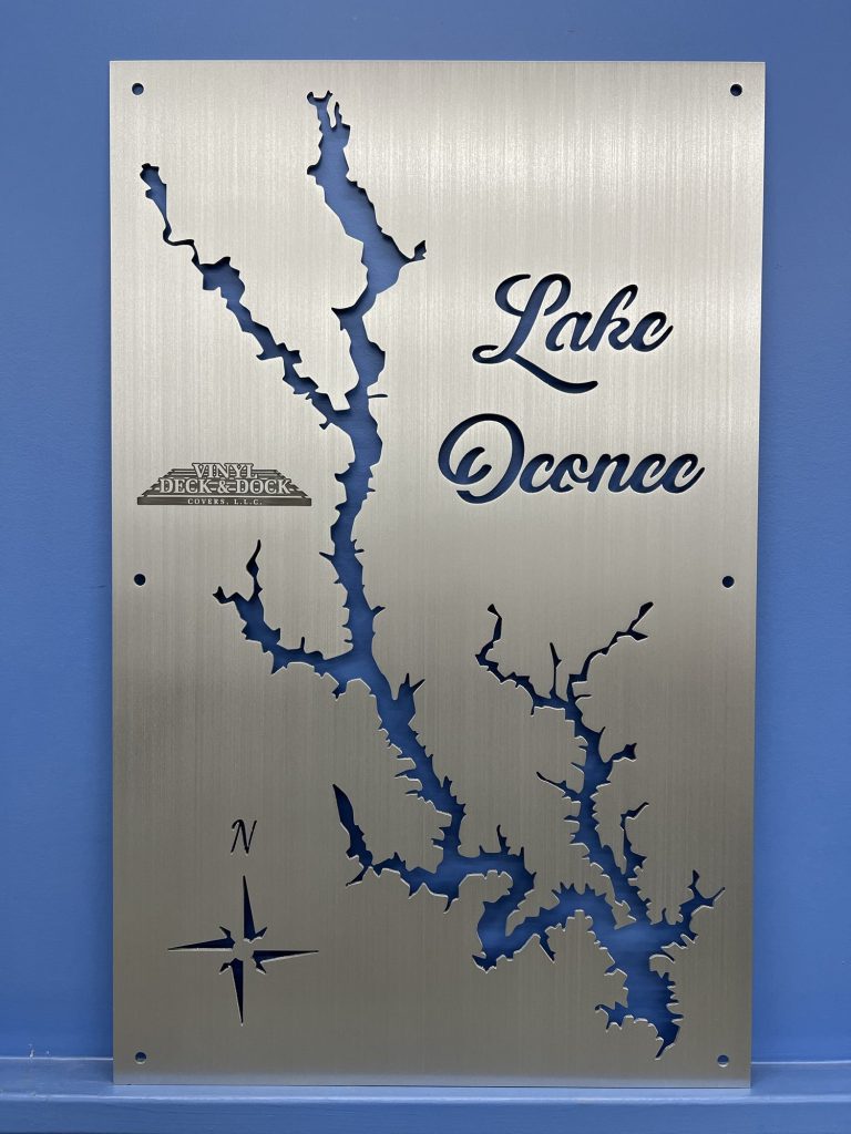 Lake Oconee metal map with compass rose and "Vinyl Deck & Dock" logo on a brushed silver background.