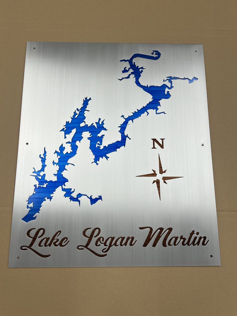 Lake Logan Martin metal map with blue cutout and compass rose on brushed silver background.