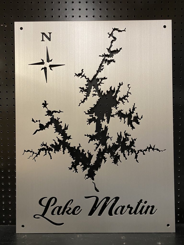 Lake Martin custom metal map with compass rose, cutout design on a perforated black background.