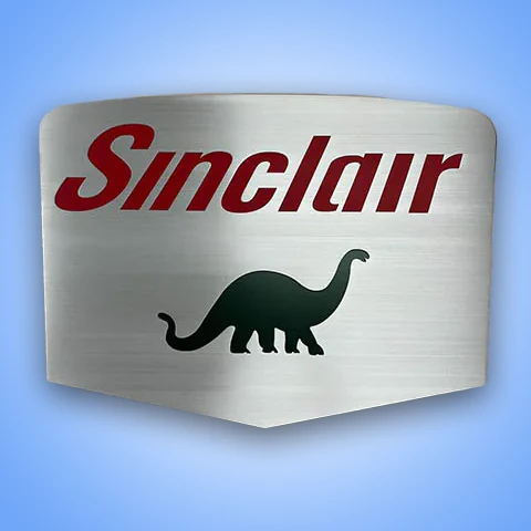 Custom metal Sinclair sign with dinosaur silhouette on a blue background.