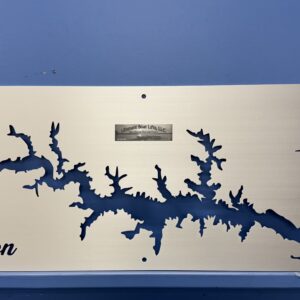 Metal wall art of Lake Gaston map with compass rose and company logo, mounted on a blue wall.