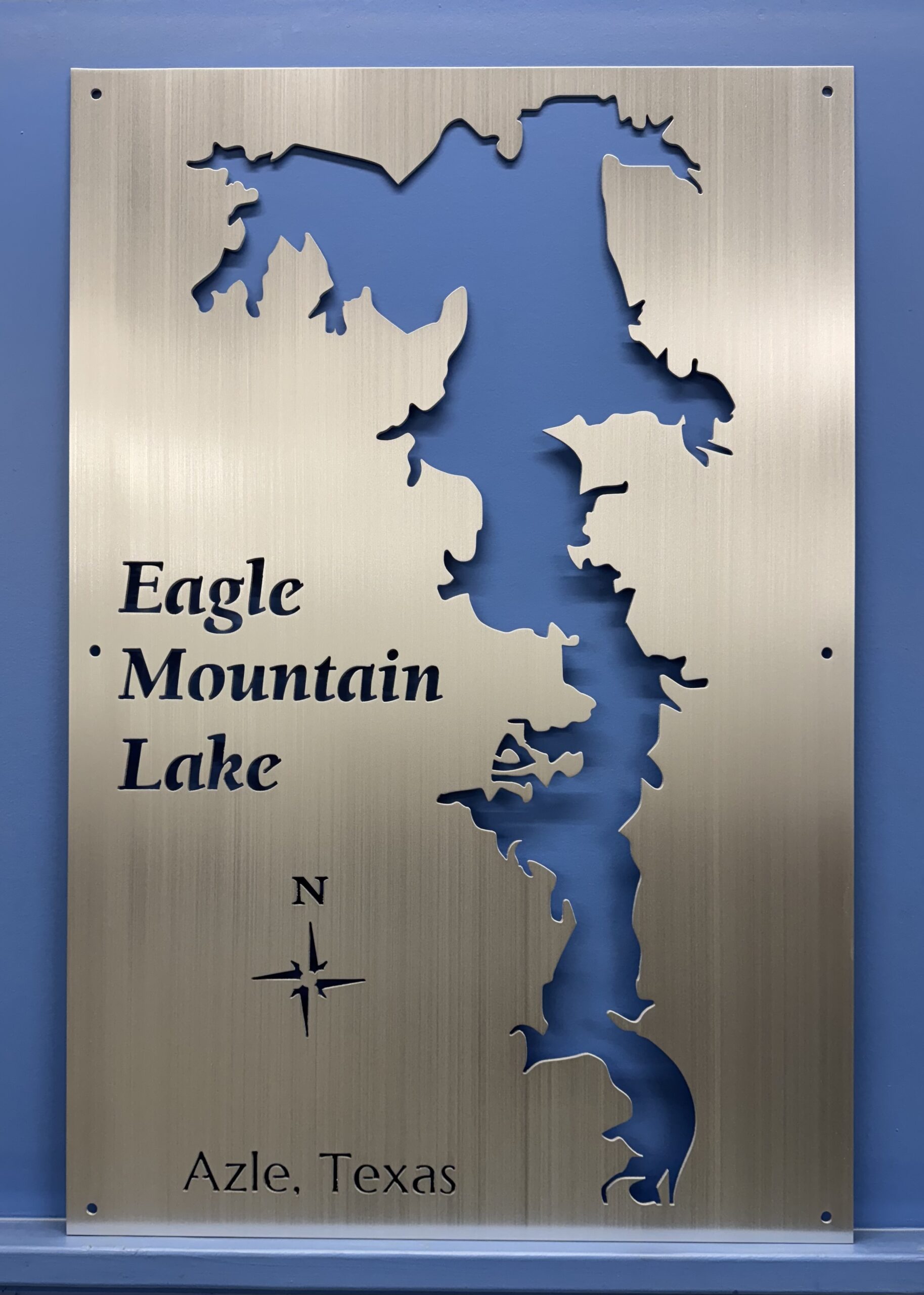 Eagle Mountain Lake map laser-cut metal sign showing lake outline, compass rose, and “Azle, Texas” text.